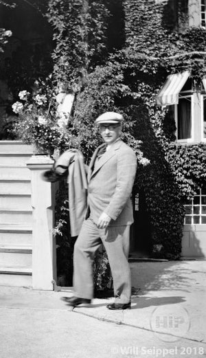 1920s Man in Suit Standing Outside House Draped in Ivy, Possibly California
