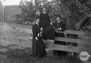 Portrait of Women on the Fence by Clarence Trefry.