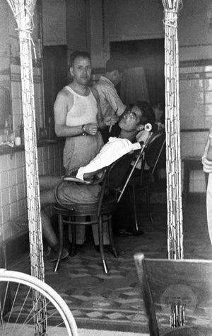 A view inside a barbershop during World War II.