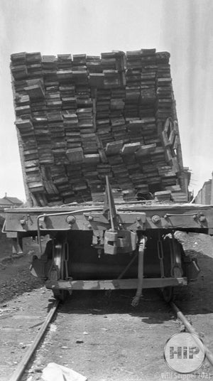 A snapshot of lumber on the back of a traincar.