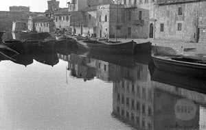 Traditional Houses and Gondolas Reflected on the Smooth Crystaline Waters of Venice, Italy 1940s