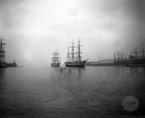 Two Schooner Ships Steering into the Misty Waters of Gloucester Harbor