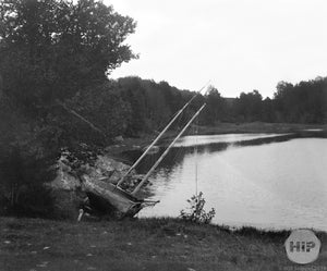 Abandoned boat and rigging stuck in lake