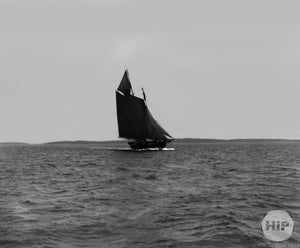 Sailboat with Dark Masts Sailing through the Waters of an Unspecified Region in New England