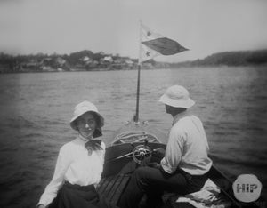 Woman posing on boat.
