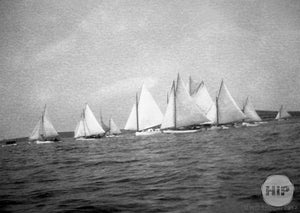 Unidentified sailboats on water.