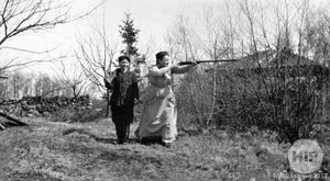 Man and woman with rifles in Cape Porpoise.