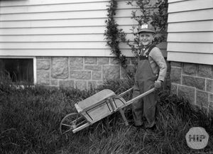 Snapshot of a boy and his wheelbarrow by Alice Curtis of Gloucester, MA.