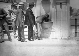 Men in Fedora styled Hats and Suits Waiting in Line at Coney Island Water Fountain