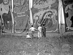 Kids Admiring a Circus Banner for the World's Largest Snakes 