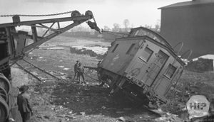 Workers clean up a trainwreck.
