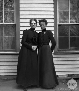 Two women sporting brooches and dresses, from the Fred Bodin collection.