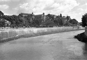 Unknown River Running Along a City and Buildings in WWII Italy