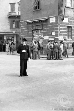 Young Police Officer Monitoring the Busy Crossroads of an Unknown Street in Italy, 1940s