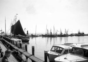 Dutch Ships and Express Boats Stationed Along a Small Harbor in Holland, 1950s