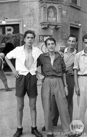 Young men posing on the streets of Italy for photographer George Sakata